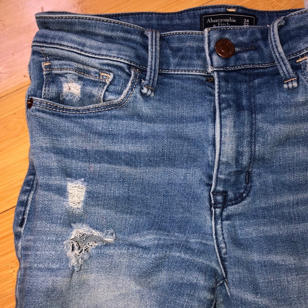 Adorable worn blue jeans